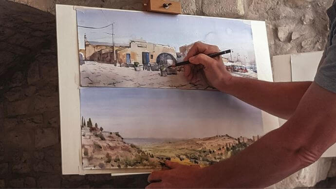 A man painting in his own time on a canvas