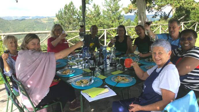 Dining together outside in Italy with friends