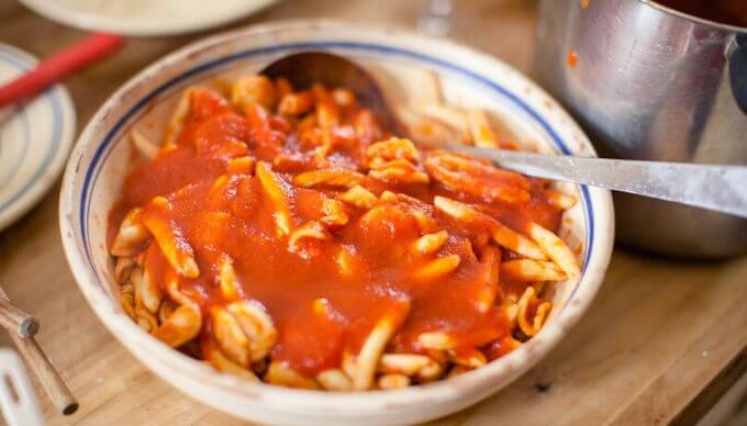 An Italian pasta dish with a tomato sauce
