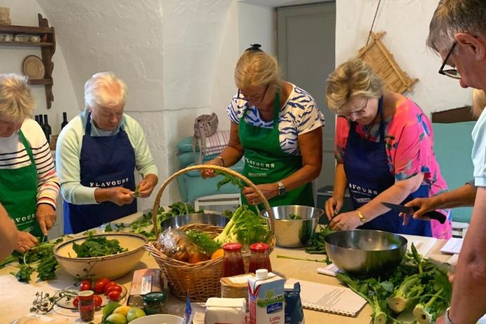 Guests cooking on their cooking holiday in Puglia