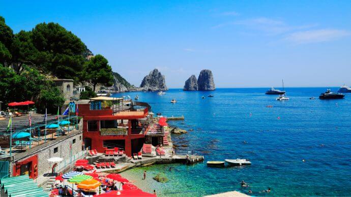 The sun shining down on the harbour at Capri