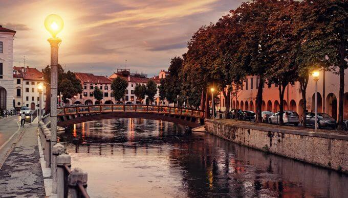 The Italian region Treviso at sunset by a canal
