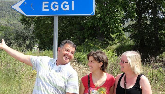 A group of people learning Italian by reading Italian signs