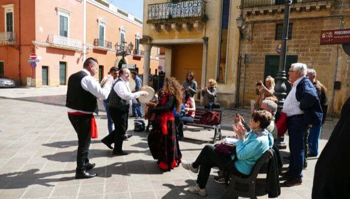 A group of street performers in Italy with live music