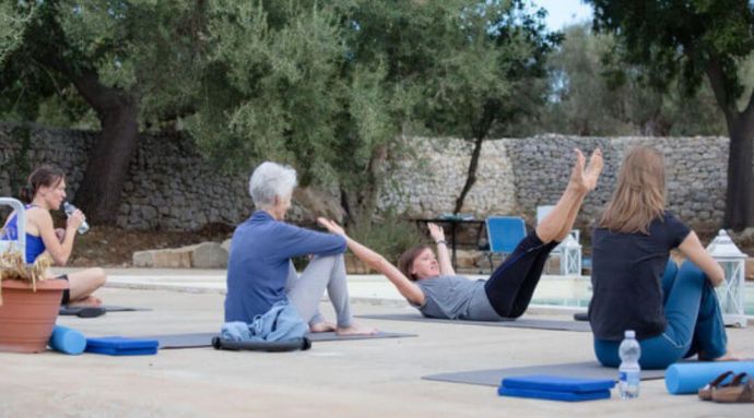 A group of ladies doing Pilates in a stunning Sicillian villa