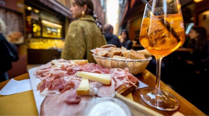 A plate of traditional Italian meats and bread from a food market