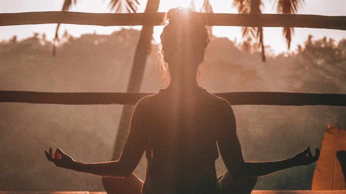 Meditating in zen yoga pose for wellness and wellbeing Meditating in zen yoga pose