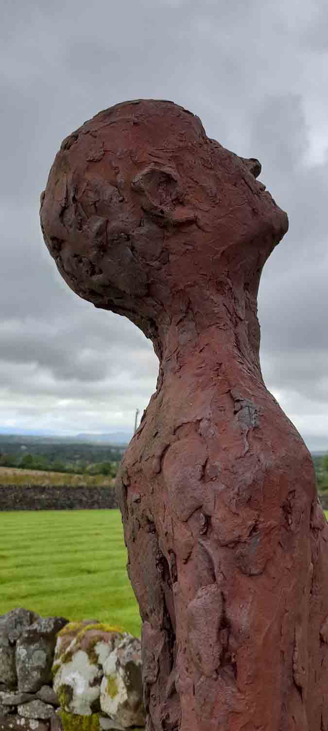 The Art of Travel Exhibition Lone Statue in Field Scotland Bob Lawson