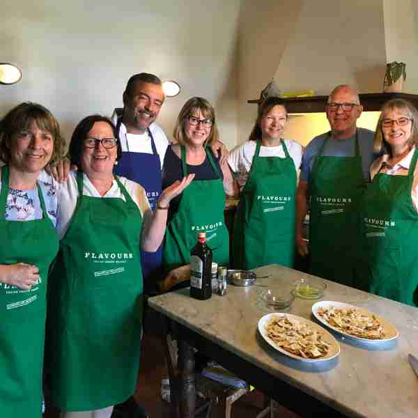 Cooking group in green aprons