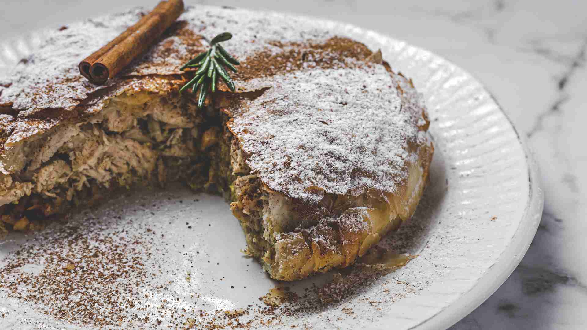 Moroccan Pastilla pastry filled with shredded chicken and North African spices. Moroccan Pastilla pastry filled with shredded chicken and North African spices.