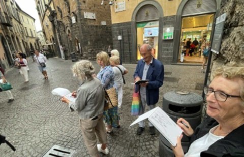 Holiday group taking the opportunity to sketch in an Umbrian town.