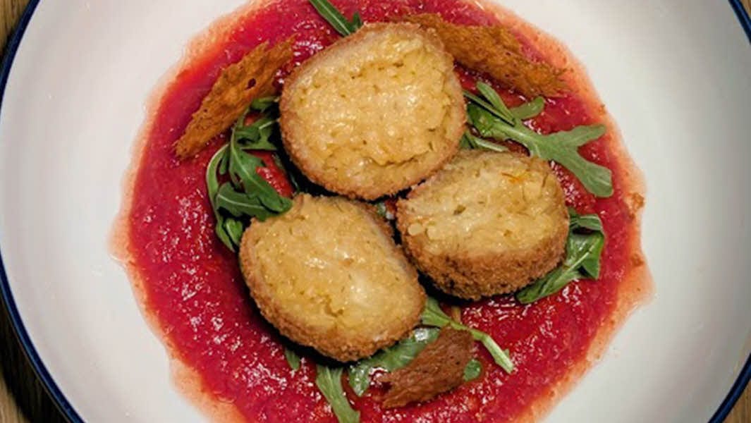 Golden Saffron Arancini with a Pecorino & Cream Heart.