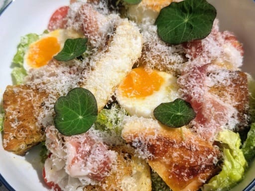 Scott's Ultimate Caesar Salad Scott's Ultimate Caesar Salad with crispy chicken, homemade Caesar dressing, jammy eggs and sourdough croutons.