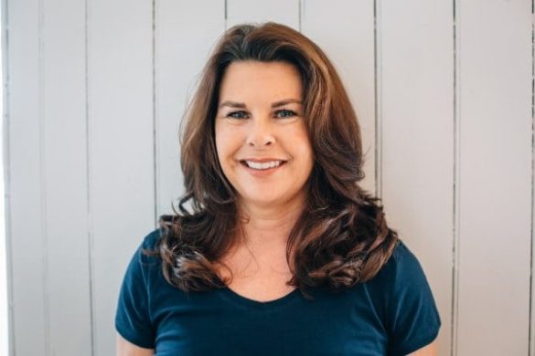 Pilates instructor, Diane Parrilla. Diane Parrilla, the Pilates instructor in studio on mat exercising Pilates