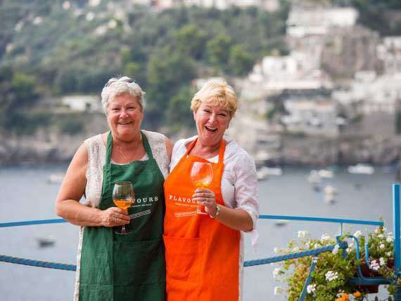 ladies-enjoying-single-holiday-in-italy Two single travellers laughing in Amalfi