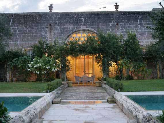 Puglia villa from outside in idyllic garden. Puglia villa from outside in idyllic garden.